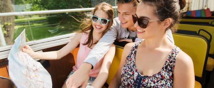 Three tourists on sightseeing bus